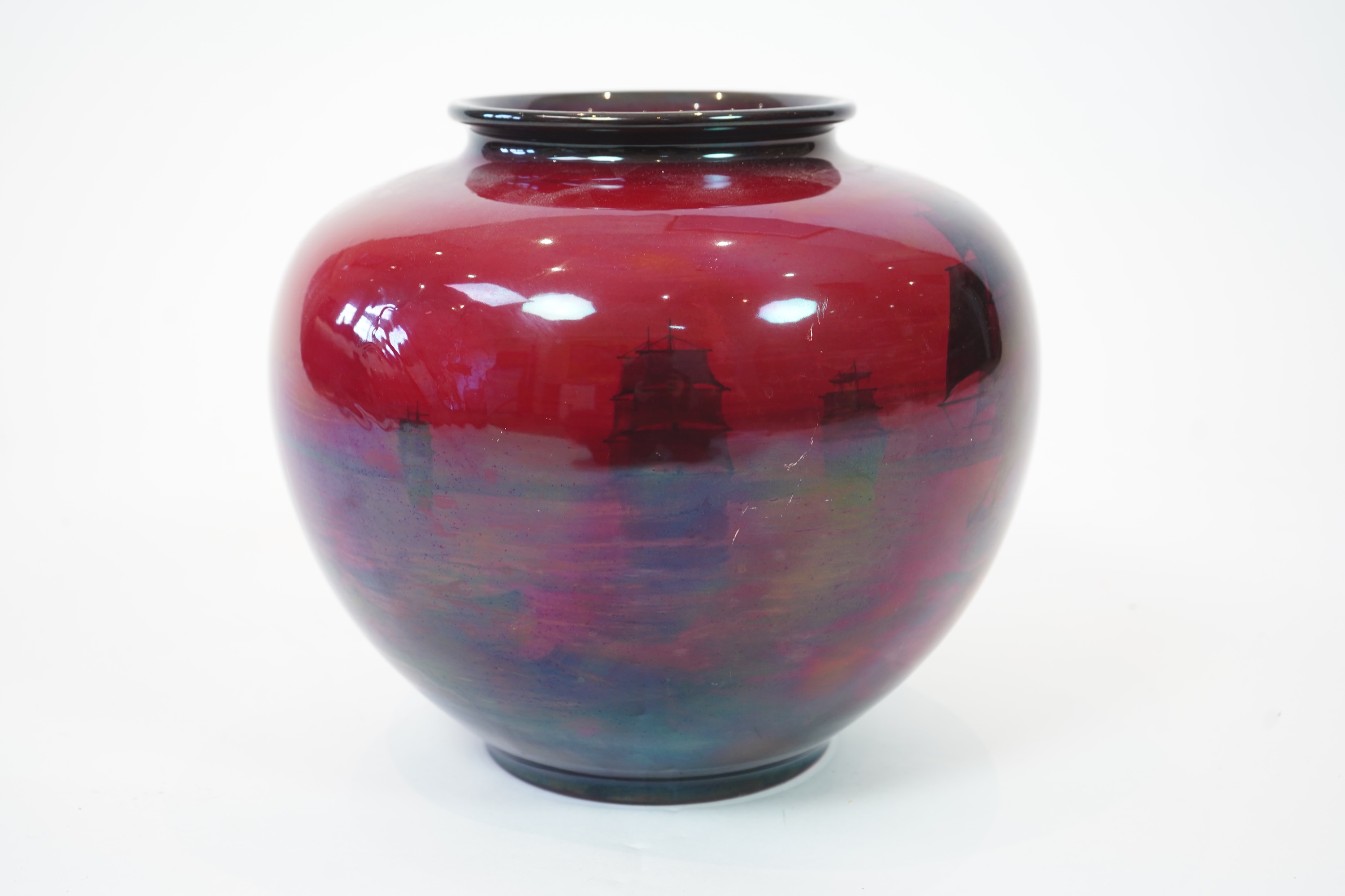 A large Doulton flambe vase decorated with ships, 29cm high